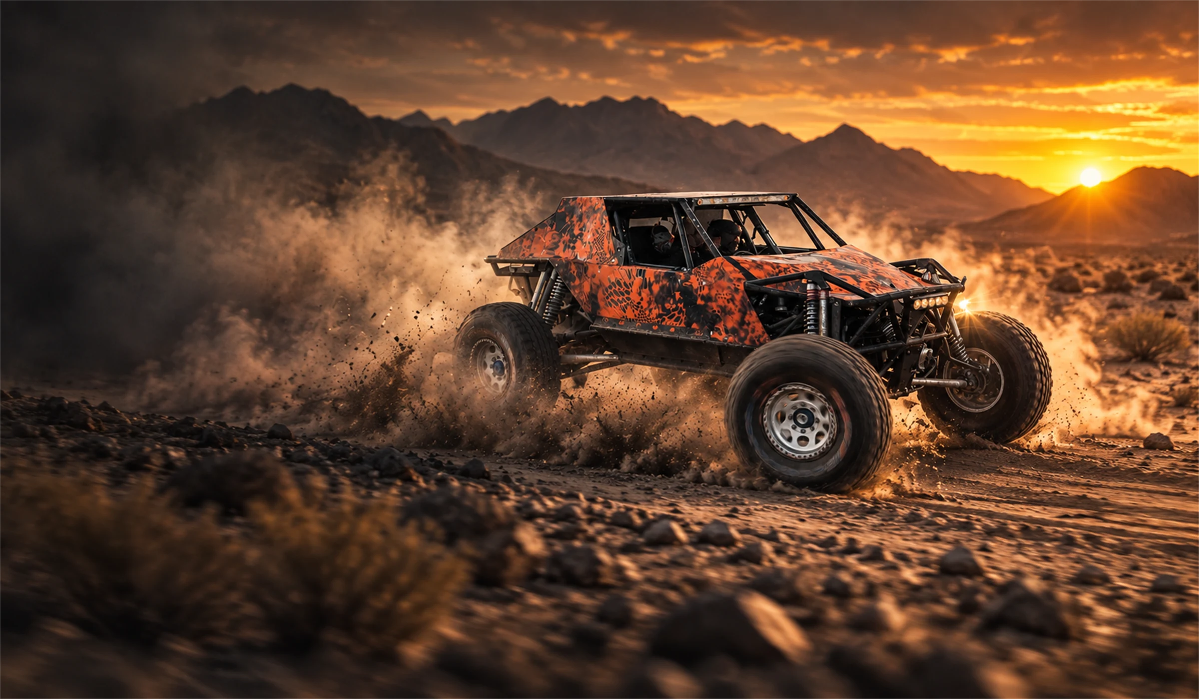 TCOR's orange-and-black off-road buggy in a smoky landscape